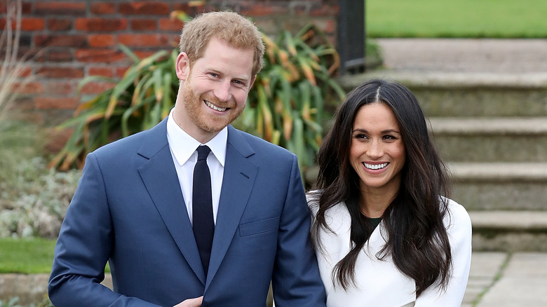 Prince Harry and Meghan Markle smiling