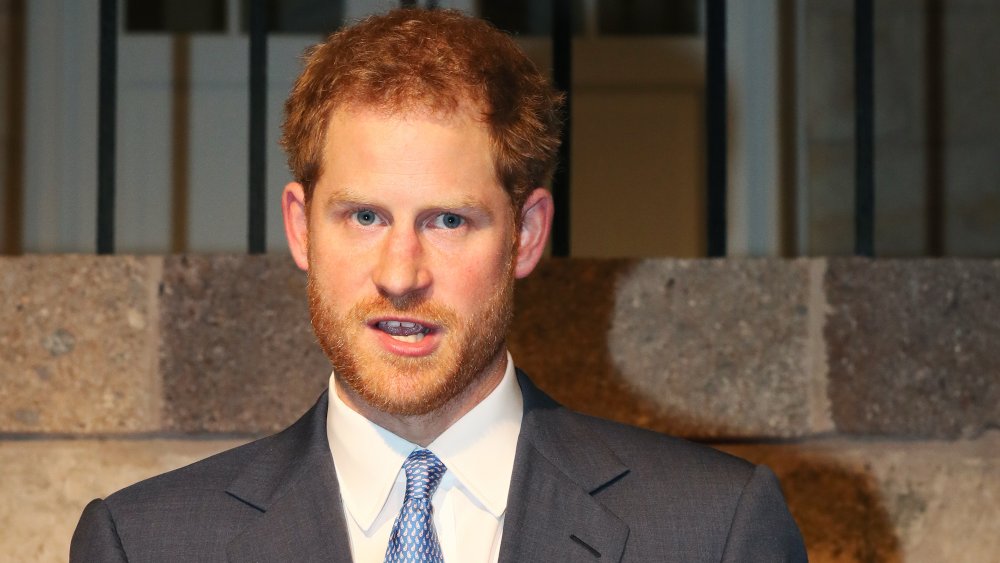 Prince Harry with mouth open, in suit