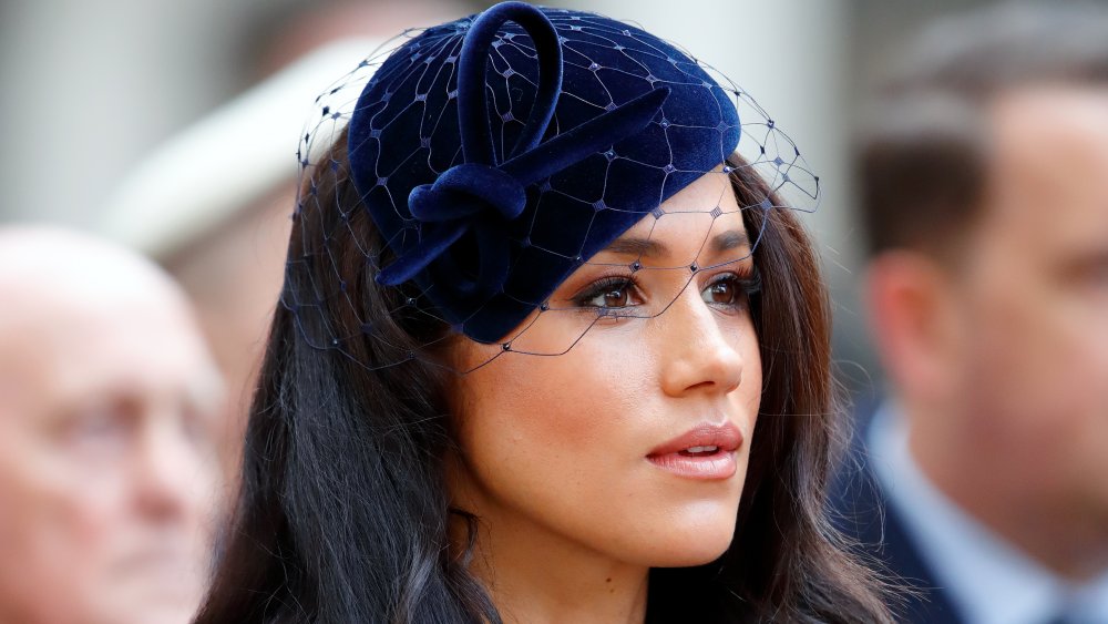 Meghan Markle in a velvet blue fascinator