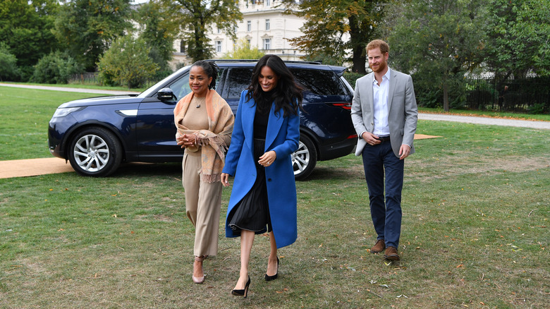 Doria Ragland with Meghan Markle and Prince Harry, walking