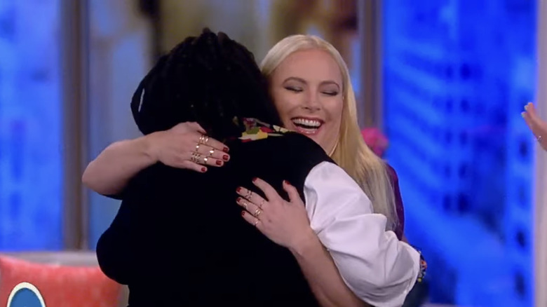 Whoopi Goldberg and Meghan McCain embracing