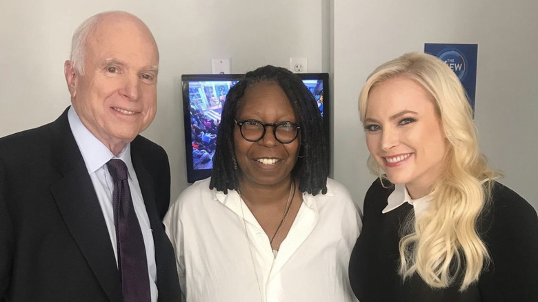 John McCain, Whoopi Goldberg, and Meghan McCain posing for picture