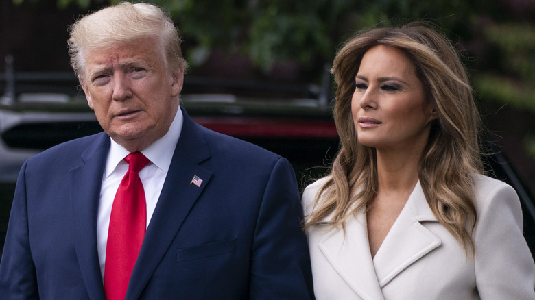 Melania Trump and Donald Trump walking