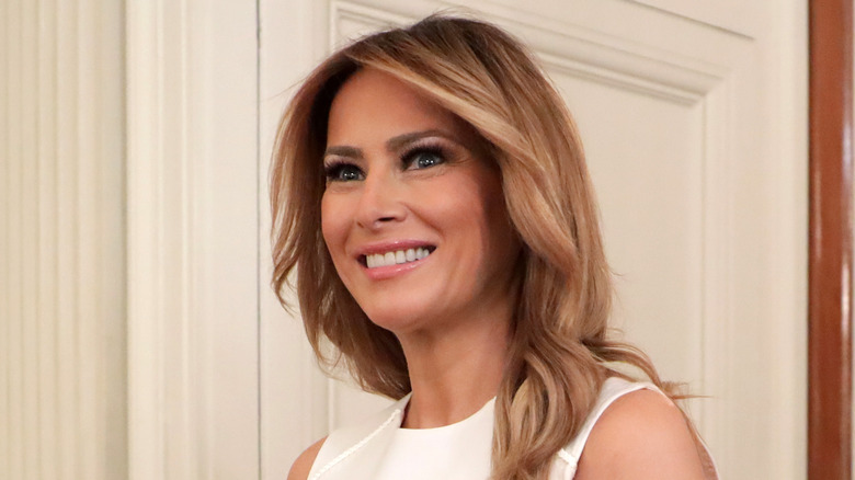 Melania Trump smiling at an event 