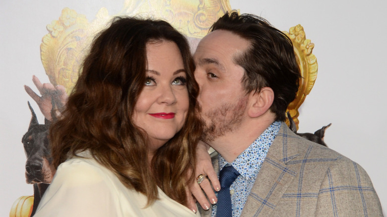 Melissa McCarthy and Ben Falcone posing