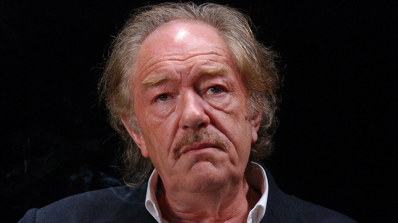 Michael Gambon with downturned mouth