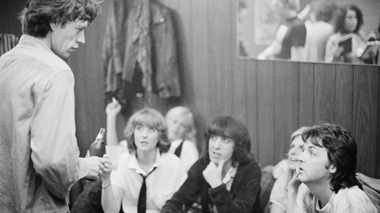 Paul McCartney, Mick Jagger and others backstage.