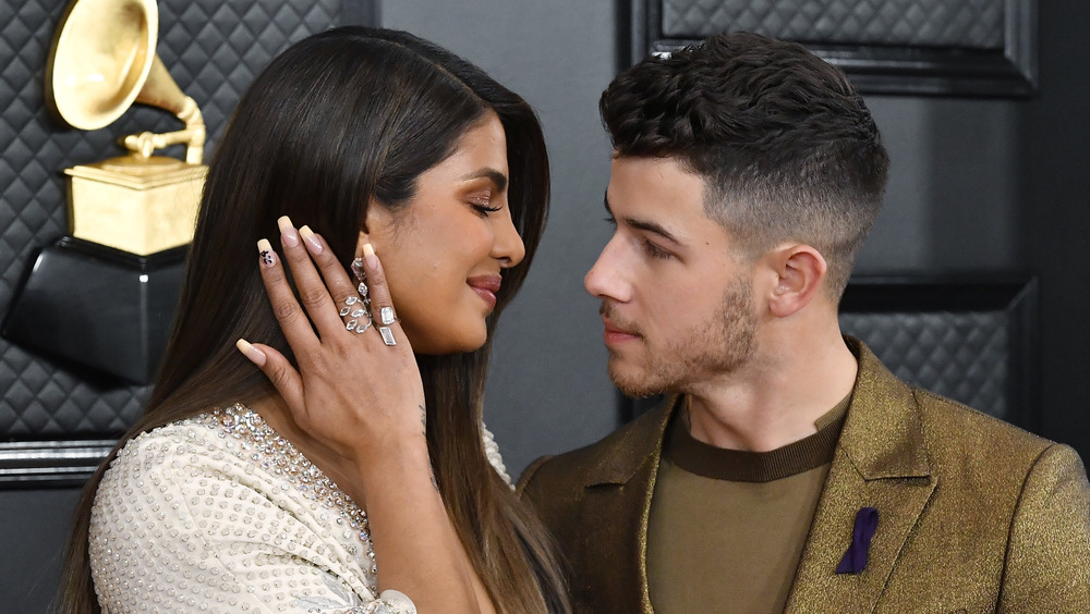 Priyanka Chopra and Nick Jonas share a smile on the Grammys red carpet