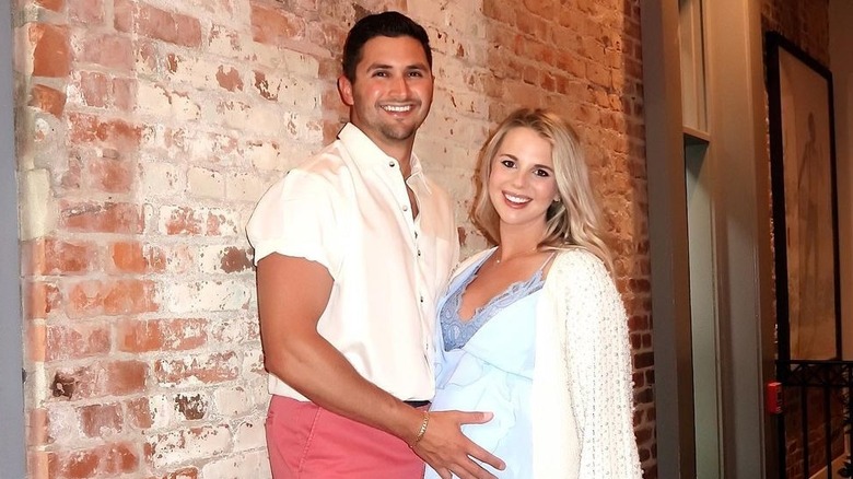 Victor Arroyo hand baby belly Nicole Franzel