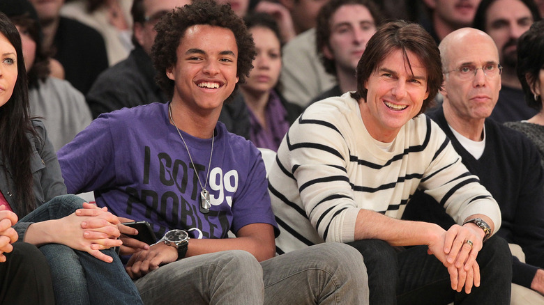 Connor and Tom Cruise at a basketball game, smiling