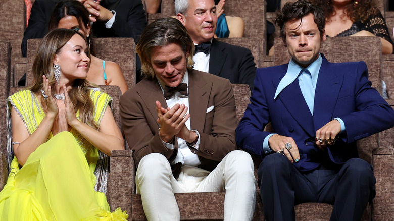 Olivia Wilde looking over Chris Pine to Harry Styles in Venice