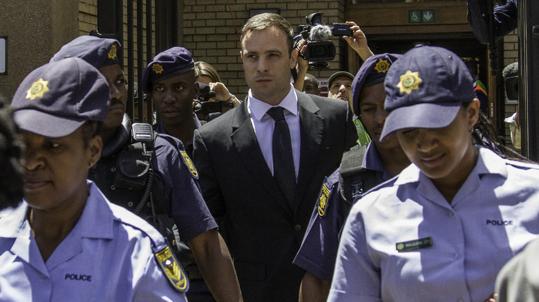 Oscar Pistorius leaving a courthouse 