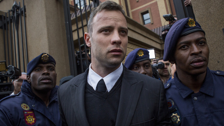 Oscar Pistorius leaving a courthouse