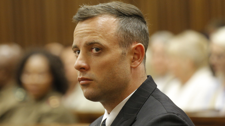 Oscar Pistorius sitting alone in court