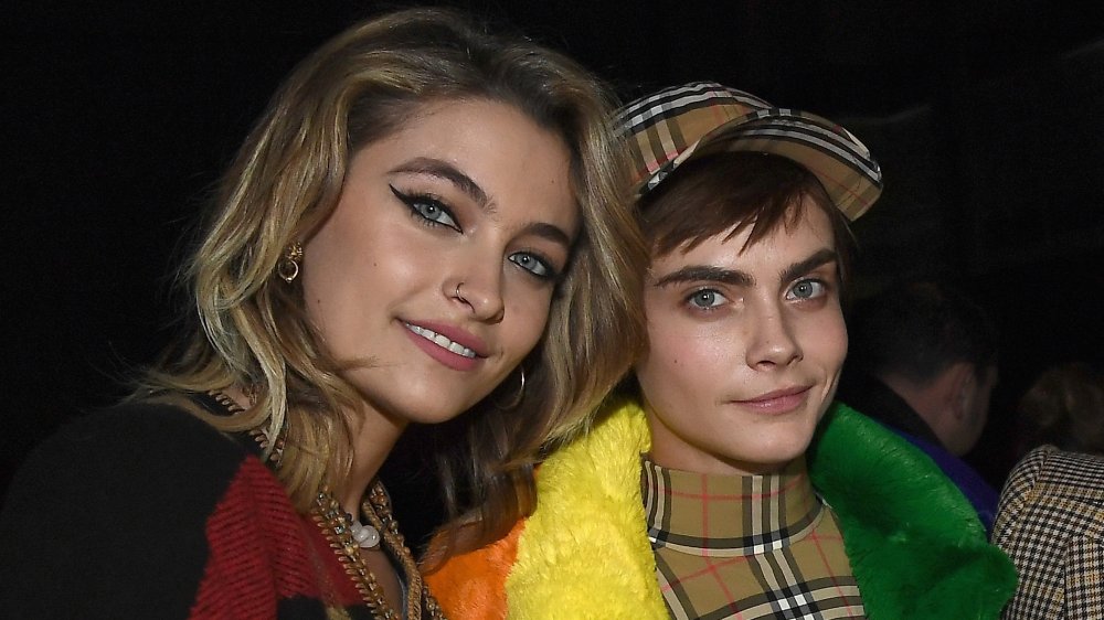 Paris Jackson and Cara Delevingne smiling at camera