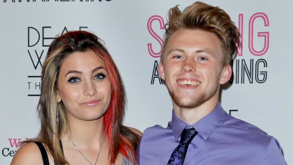 Paris Jackson smirking with then-boyfriend Chester Castellaw