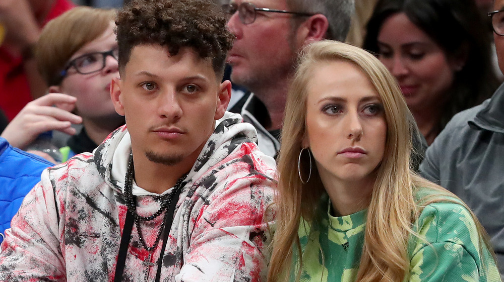 Patrick Mahomes and Brittany Matthews sit courtside at a basketball game in 2020