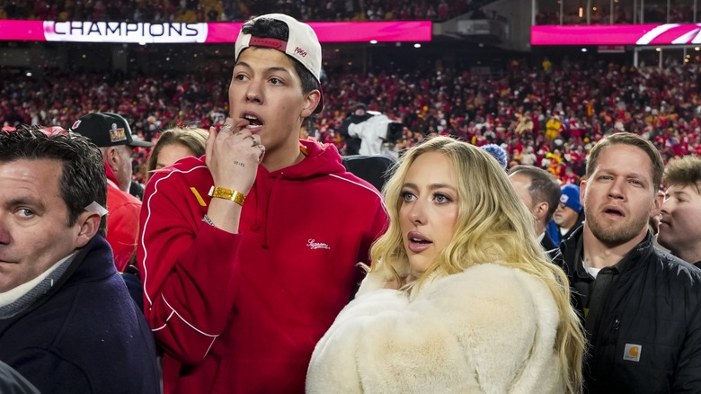 Jackson and Brittany Mahomes on the field at a Chiefs game