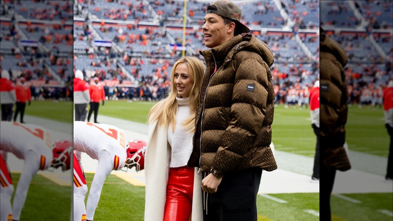 Jackson and Brittany Mahomes posing for pictures