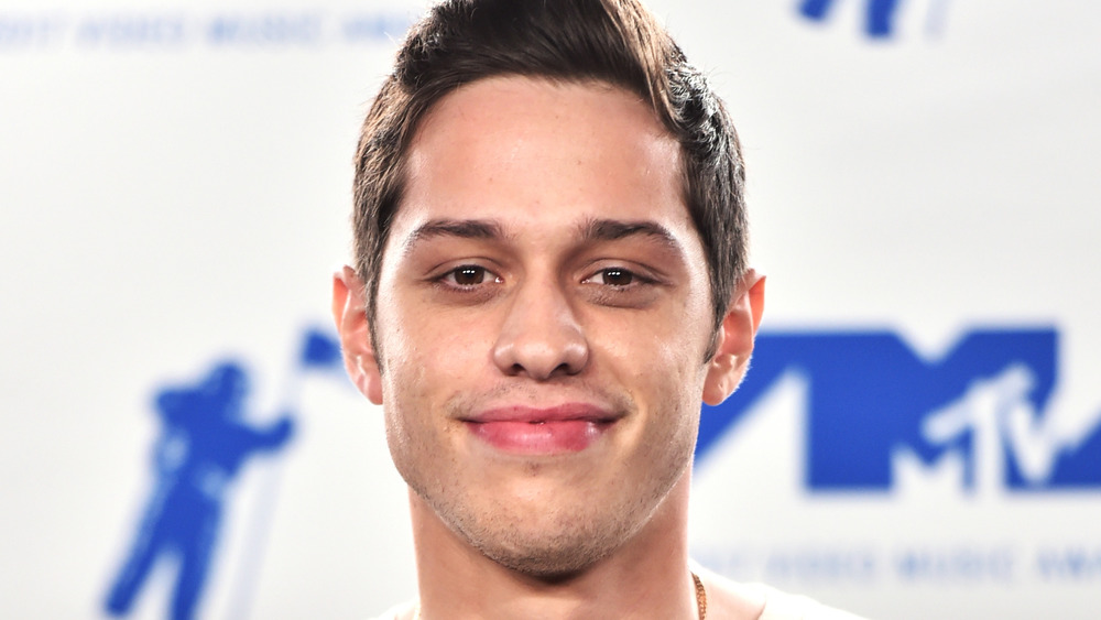 Pete Davidson smiling at an event