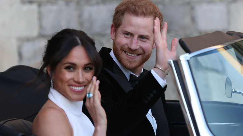 Meghan Markle and Prince Harry waving