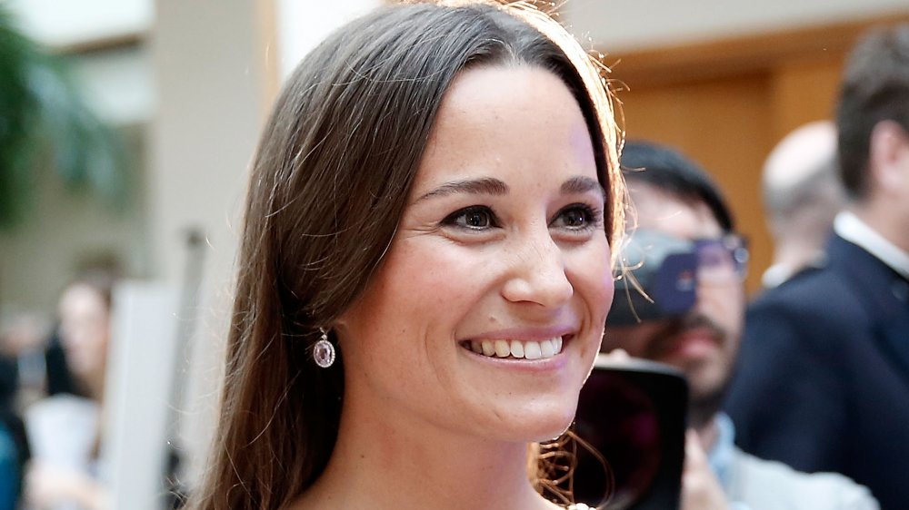 Pippa Middleton smiling while looking off to the side