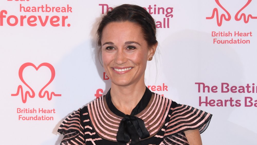 Pippa Middleton smiling and posing at a charity event