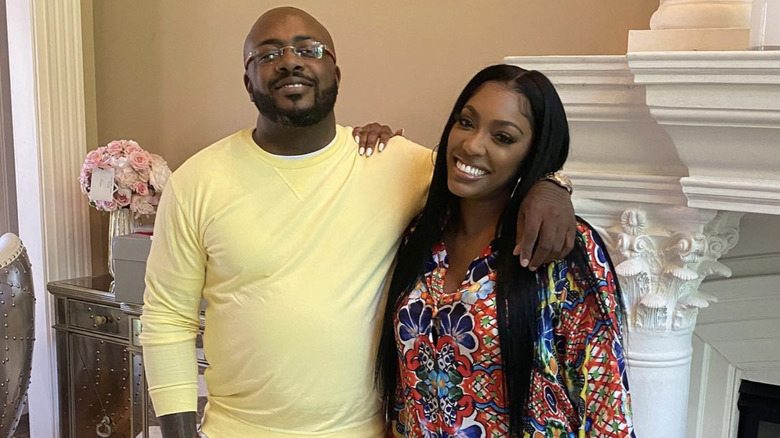 Dennis McKinley and Porsha Williams posing in 2021