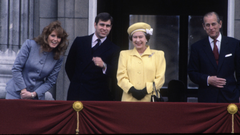 Sarah Ferguson, Prince Andrew, Queen Elizabeth II, and Prince Philip smiling at the crowd