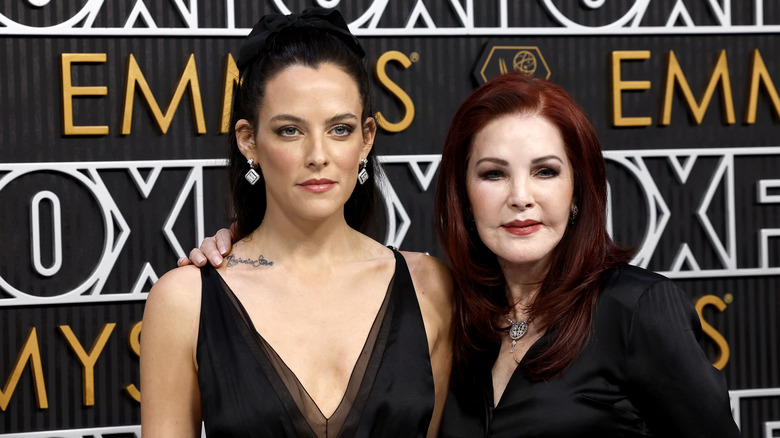 Priscilla Presley with arm around Riley Keough