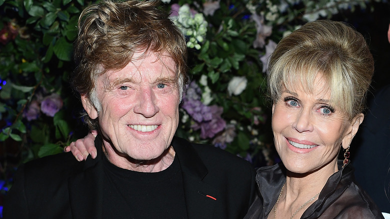 Jane Fonda with hand on Robert Redford's shoulder 2017.