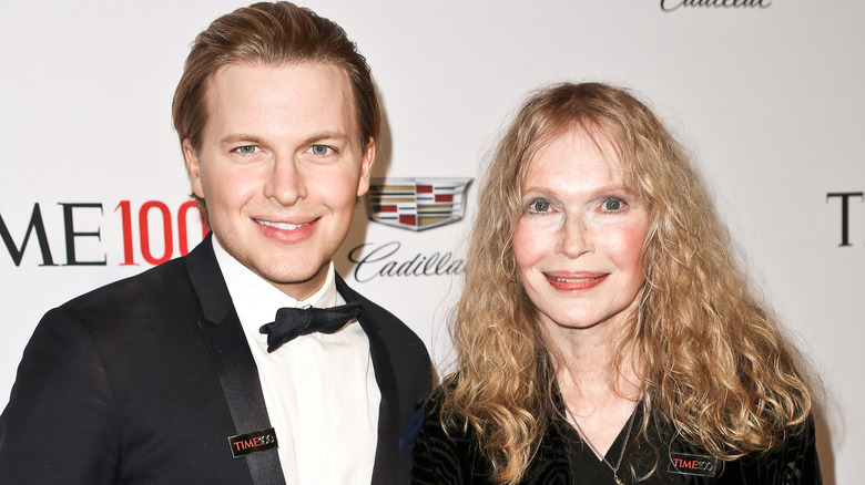 Ronan Farrow, Mia Farrow, posing