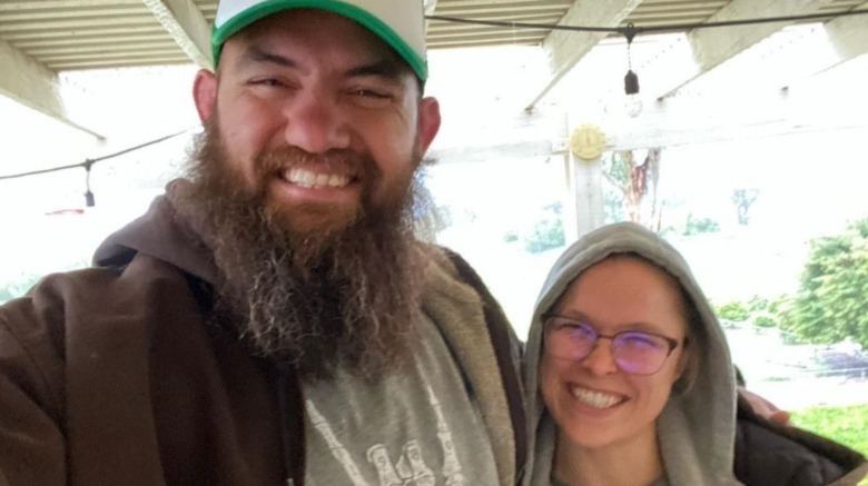 Travis Browne and Ronda Rousey smiling in a selfie