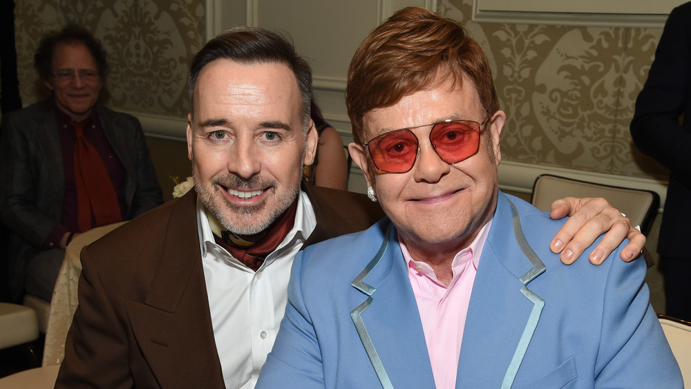 Elton John and David Furnish smiling