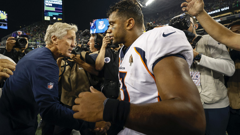 Pete Carroll shaking hands Russell Wilson