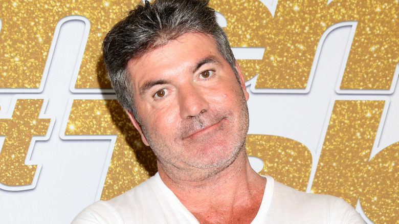 Simon Cowell head tilted