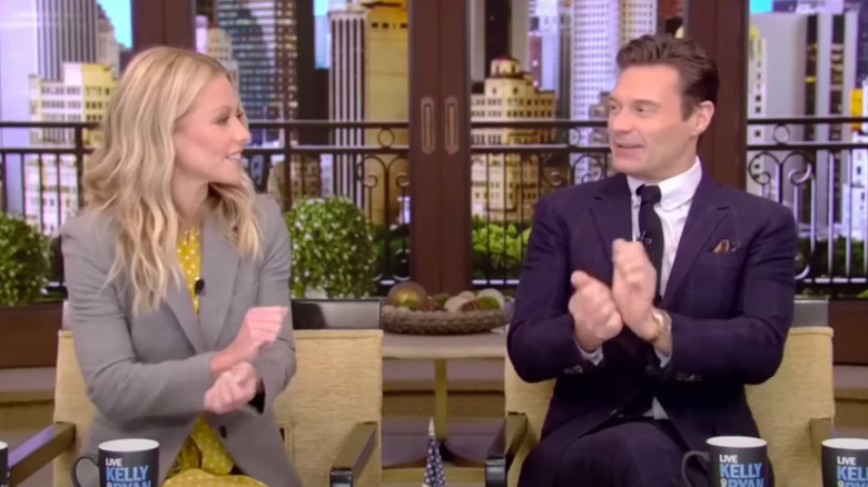 Kelly Ripa and Ryan Seacrest being goofy on set