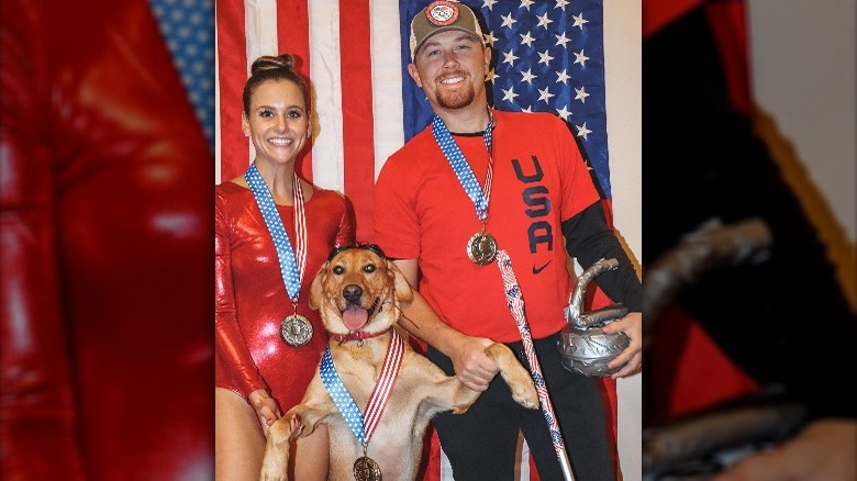 Scotty McCreery in costume with wife Gabi and pet dog