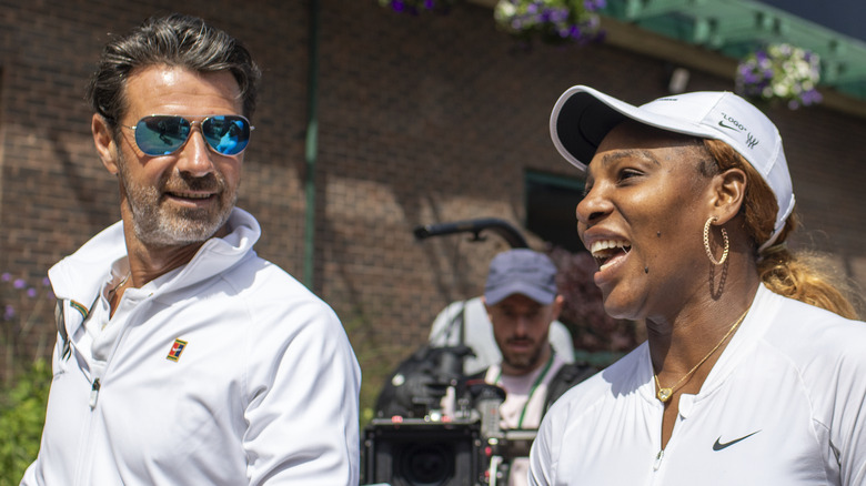 Patrick Mouratoglou and Serena Williams walking together