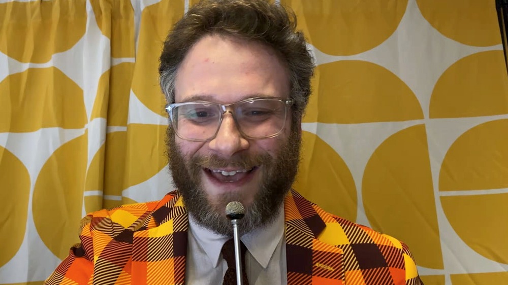 Seth Rogen speaking into a microphone