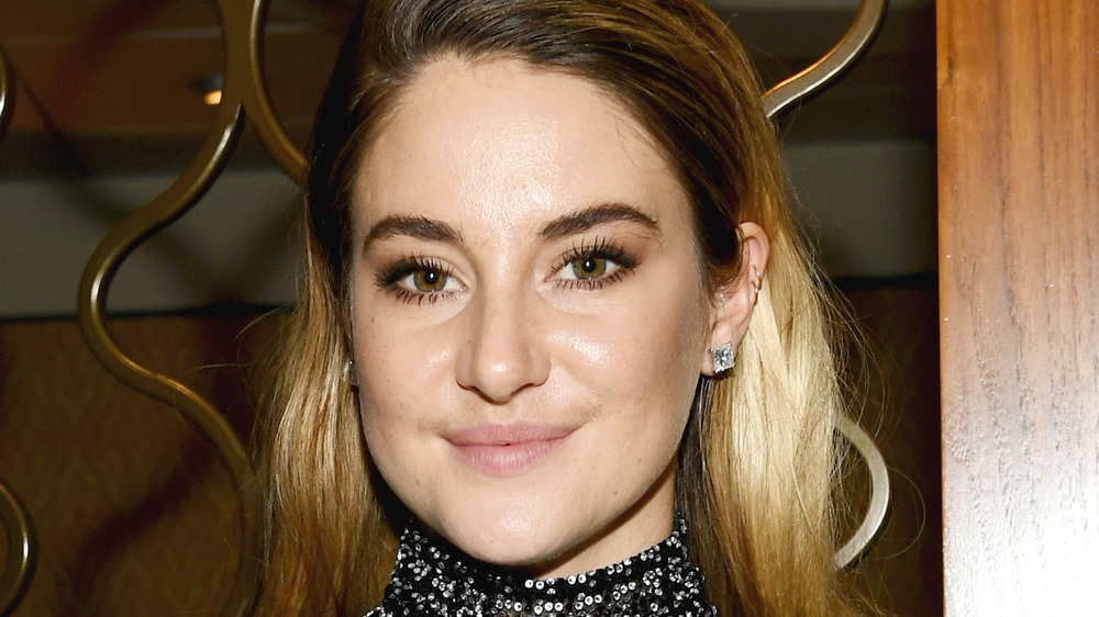 Shailene Woodley poses in a black sparkly blouse