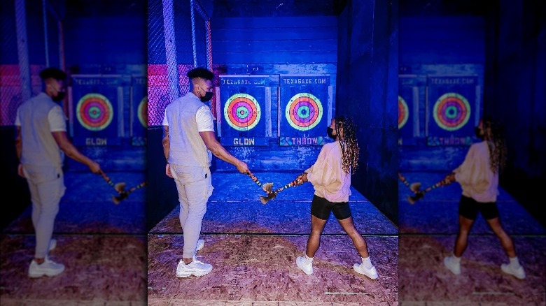 Simone Biles and Jonathan Owens throwing axes