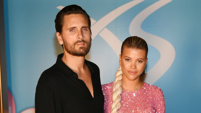 Sofia Richie and Scott Disick pose