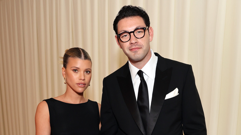 Sofia Richie and Elliot Grainge in black formal wear