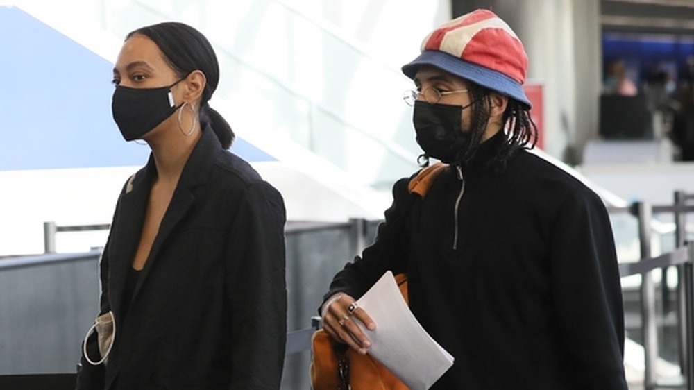 Solange Knowles and Gio Escobar arrive at an airport in 2020