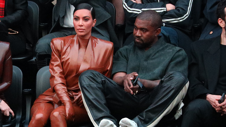 Kim Kardashian and Kanye West watching