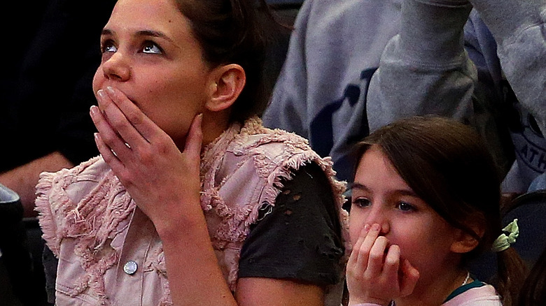 Katie Holmes and Suri Cruise in audience 