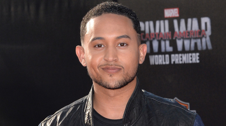 Tahj Mowry looks at camera