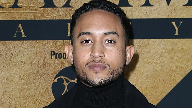 Tahj Mowry looks at camera