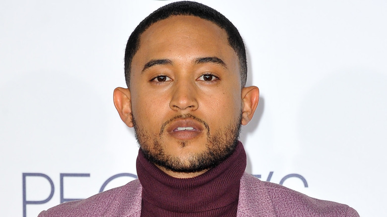 Tahj Mowry looks at camera